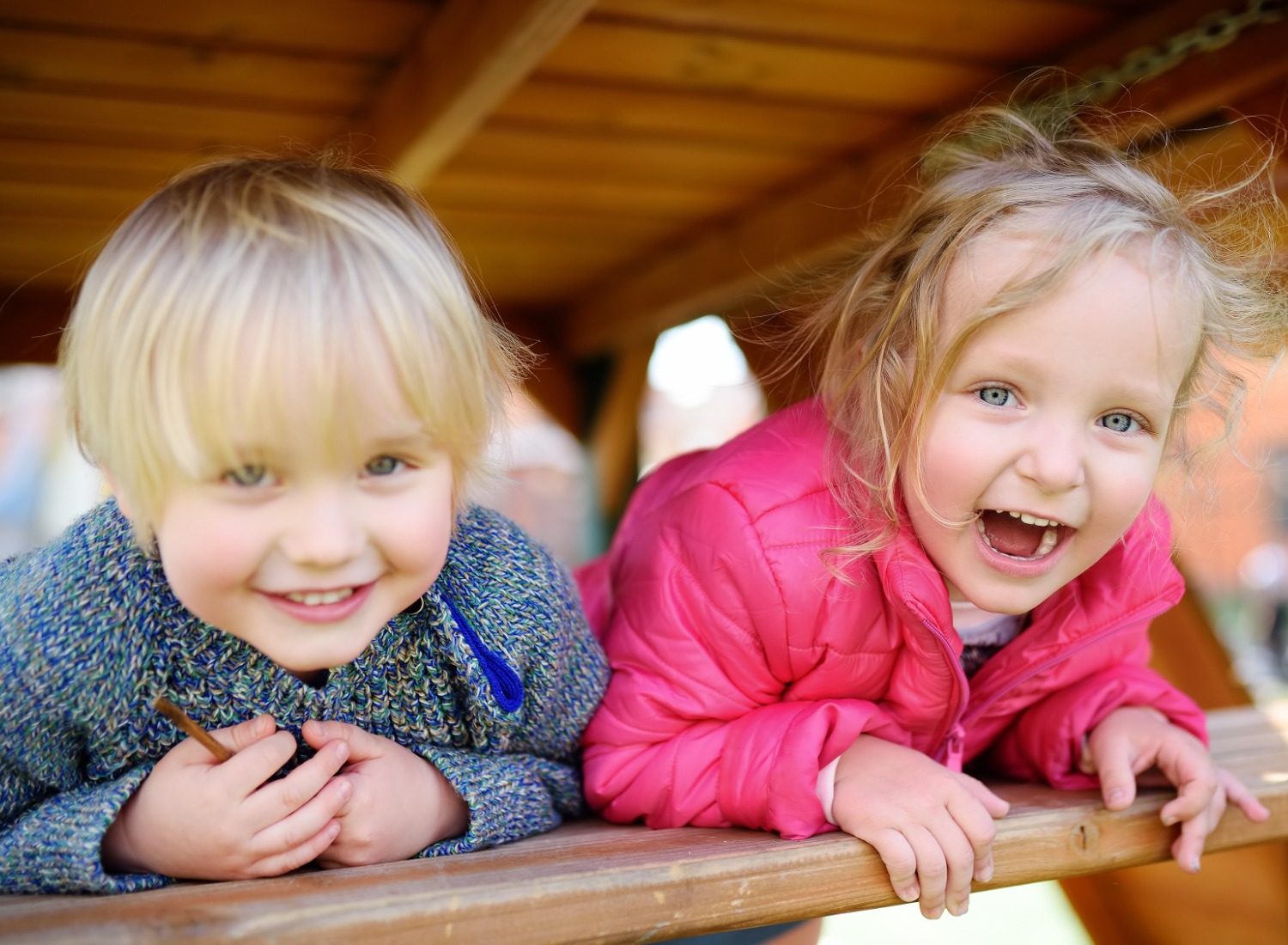 Two toddlers having fun outside