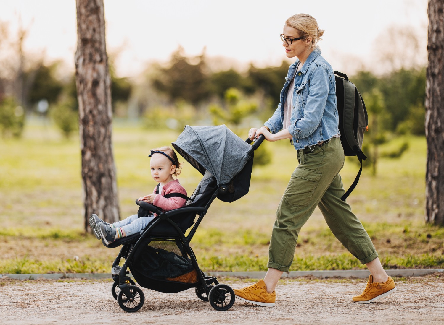 Woman pushing a baby in a stroller